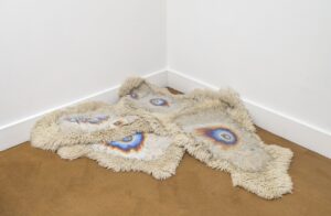 Hanneline Rogeberg, Installation shot of Petroleum Soul Pile-Up, multiple sheep skins, gesso, oil, dimensions variable 2014 - 2021